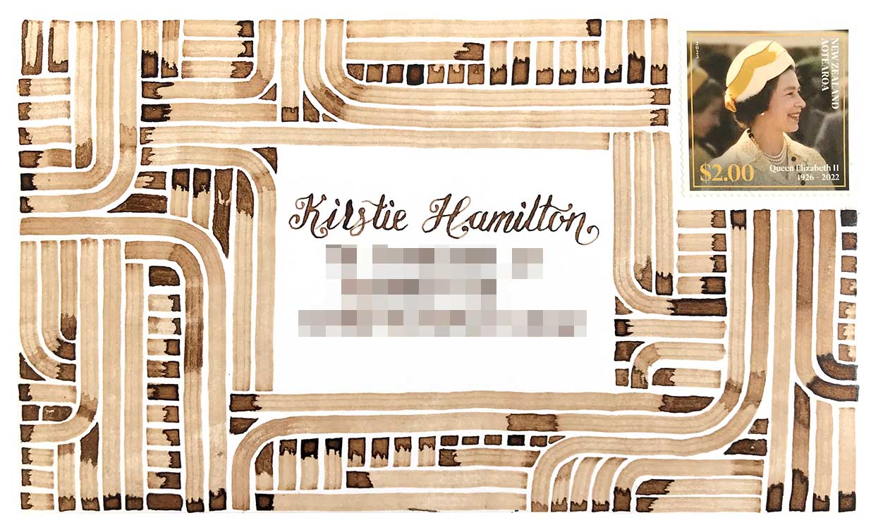 An envelope addressed to Kirstie Hamilton, with a Queen Elizabeth II stamp in the top right corner. The envelope is covered in lots of parallel lines, some bending at 90 degrees with rounded corners.