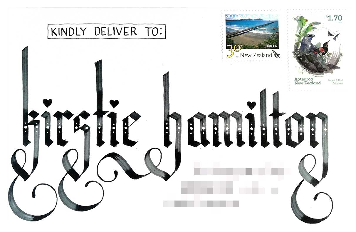 An envelope addressed to Kirstie Hamilton using blackletter calligraphy and large descender flourishes.